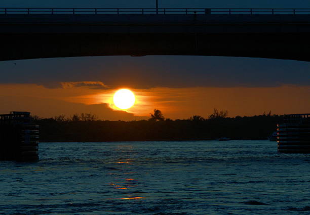 Sunset under the bridge stock photo