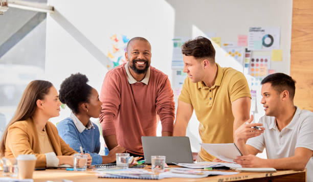 istock Creative presentation, teamwork and black man in meeting talking, in discussion and brainstorming ideas. Leader, collaboration and business people for planning, marketing strategy and brand project 1791262750