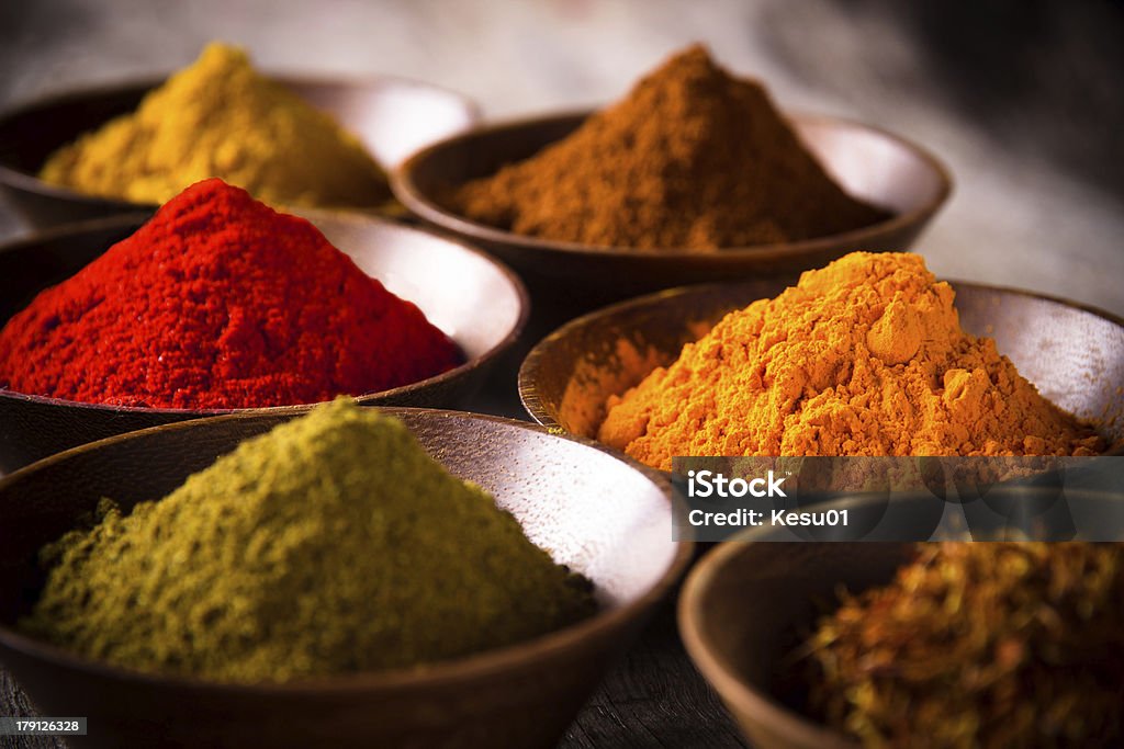 Assorted spices Assorted spices on wooden table Allspice Stock Photo