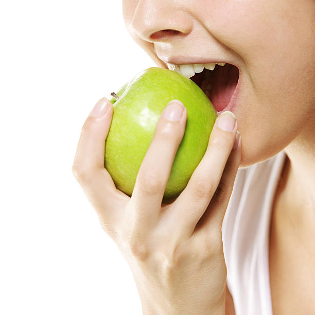 istock woman with apple 179126460