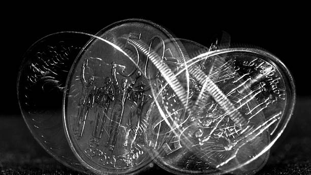 Rolling coin Stroboscopic effect created using flash capturing the motion of a coin as it is rolling temporal aliasing stock pictures, royalty-free photos & images
