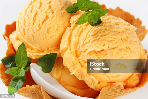 Orange Sherbet In A Waffle Basket Stock Photo - Download Image Now - Peach Ice Cream, Baked Pastry Item, Bowl