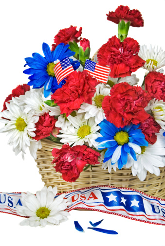 Patriotic bouquet bouquet with flag and ribbon on white background.