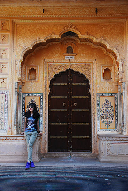 istock woman by the old door 179128043