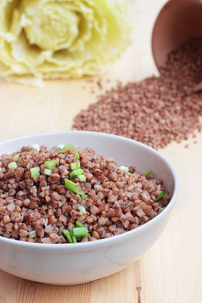 istock Buckwheat in a bowl on the wooden table 179128081