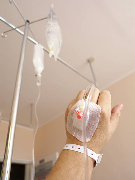 istock Patient's hand in the hospital with an IV 179128134