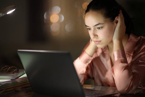 istock Woman working online in the night 1791293406