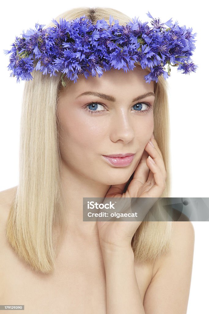 Organic beauty Portrait of young beautiful fresh girl with blue flowers, over white background Adult Stock Photo