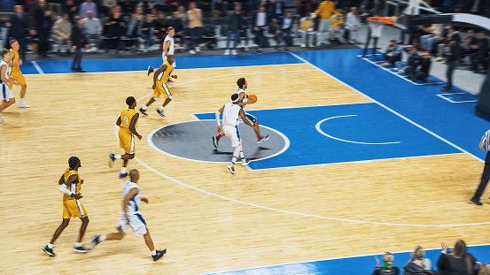 Basketball Tournament Final: Player Passing the Ball to a Skillful Teammate, Sportsmen Dribble Around Defense Two Successfully Score a Two-Pointer Ball. Exciting Sports Action on Live TV.