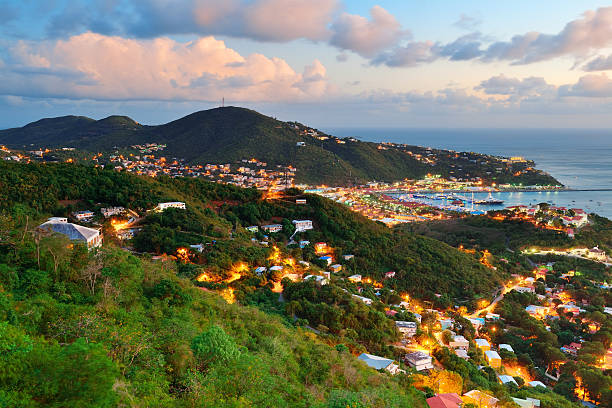 St Thomas sunset Virgin Islands St Thomas sunset mountain view with colorful cloud, buildings and beach coastline. st. thomas virgin islands photos stock pictures, royalty-free photos & images