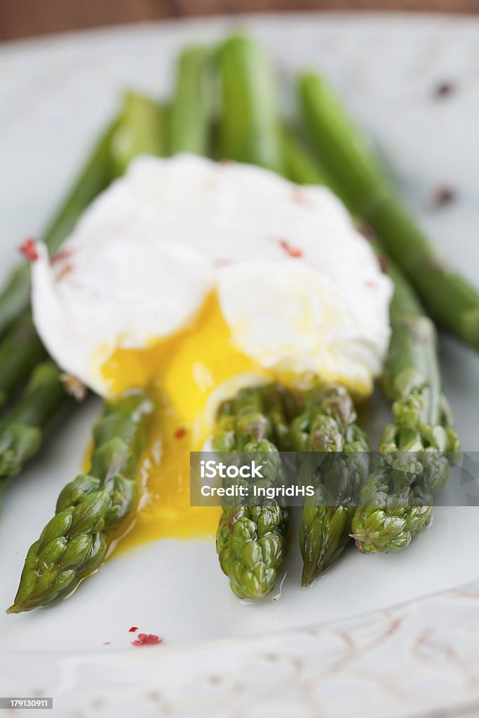 Asparagus with poached egg Green asparagus with poached egg on a plate.  Appetizer Stock Photo