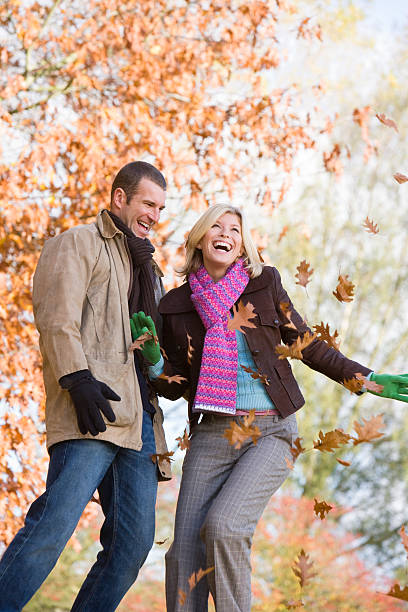 istock Young couple having throwing leaves in the air 179131318