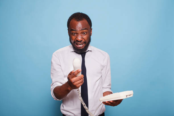 istock Black Businessman Yelling Into Phone 1791317623