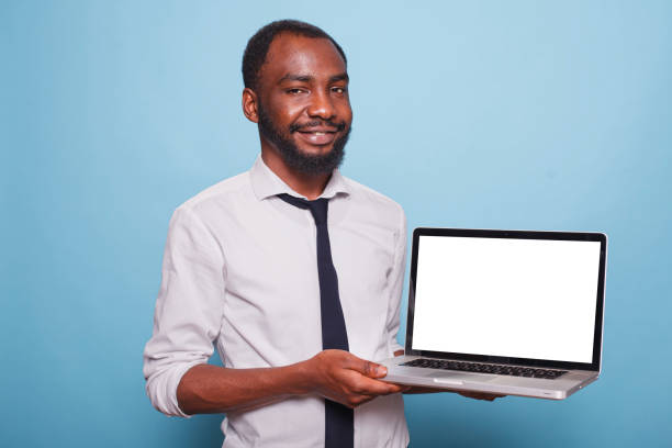 istock Black Man Holds Laptop With White Screen 1791318732