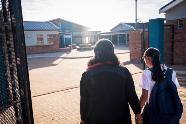 istock Mother drops her young daughter off at school 1791322086
