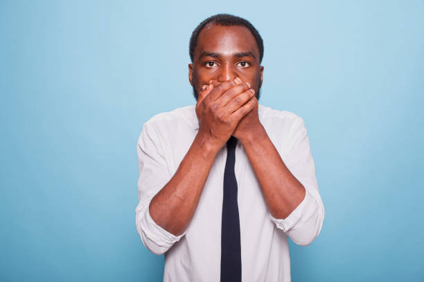 istock Shocked Man Covers His Mouth With Hands 1791325333