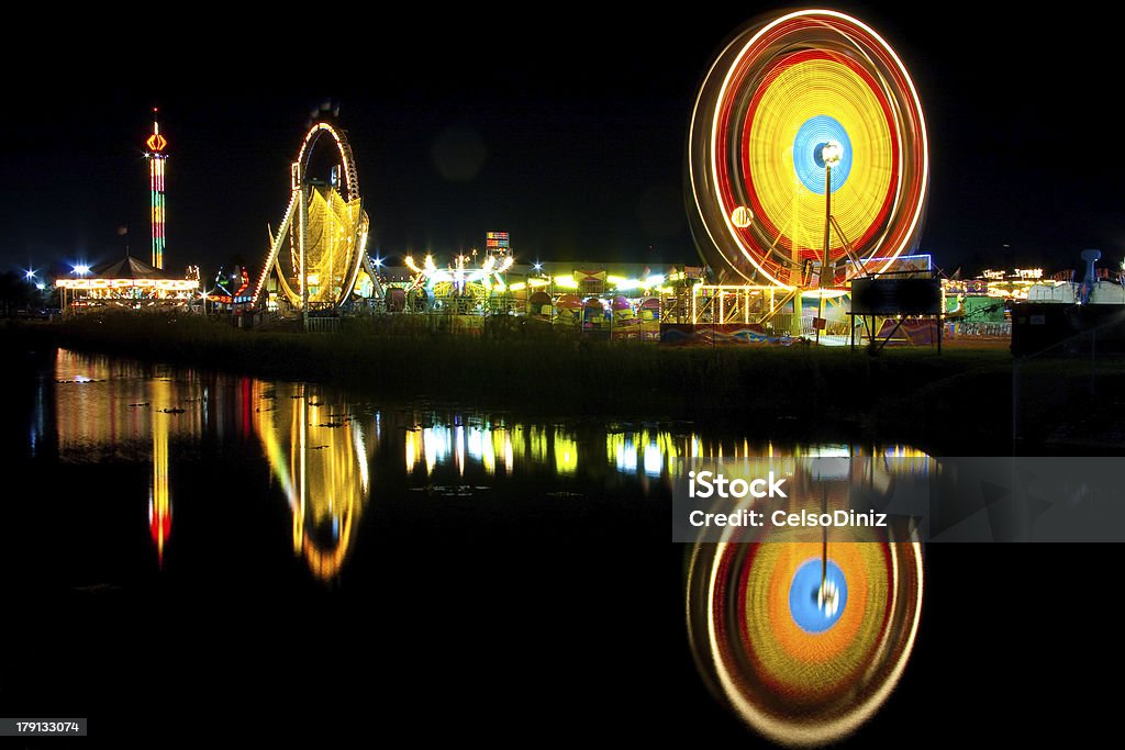 Ferris wheel at night A night shot of a Ferris wheel by a lake. Architecture Stock Photo