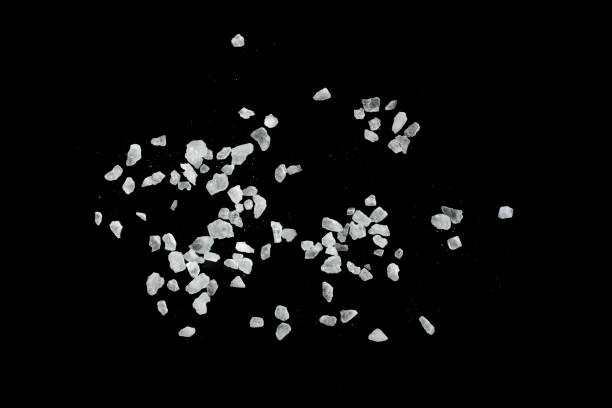 istock Sea salt crystals isolated on black background. 1791344395