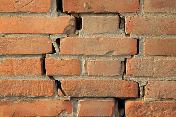 istock crack of red brick wall 179134592