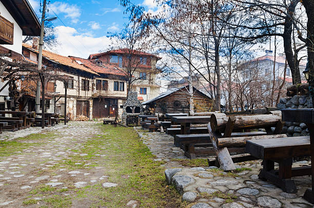 istock old architecture houses and stone paved road, Bansko, Bulgaria 179135922