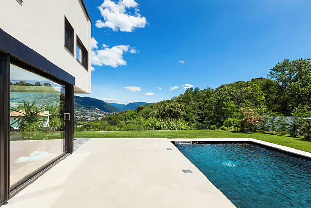 Lush, mountain side view from modern villa with a pool stock photo