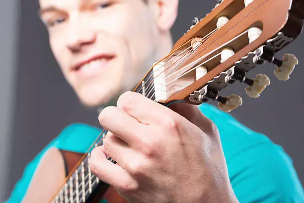 Photo of Happy Young Man With Guitar