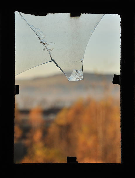 Old window with broken glass stock photo