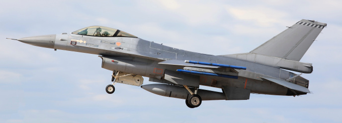 F-16C Fighting Falcon with undercarriage down preparing to land.