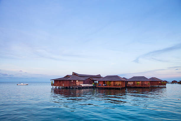 istock house over water at coastline 179138056