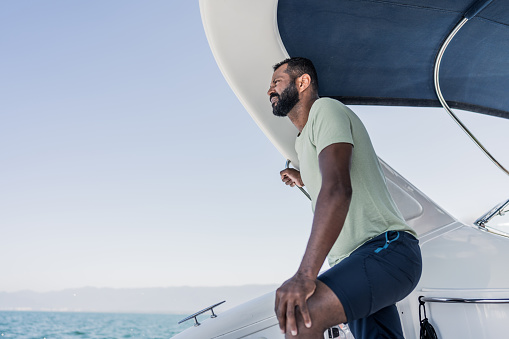 Mature man contemplating in a speedboat