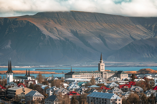 Cityscape of Reykjavík, the capital city of Iceland with the volcanic mountain range Esjan