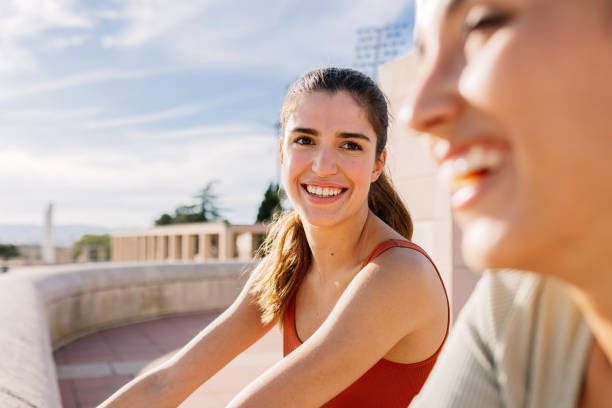 istock Two young fitness women doing stretching exercise after workout routine outside 1791402557