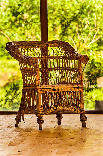 istock Rattan chair near a large window 179140879