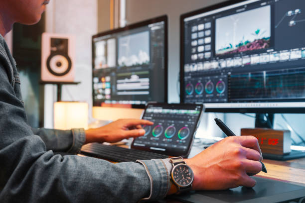 istock Asian male creator, works with footage or video on his personal computer, in his creative office studio. 1791416485