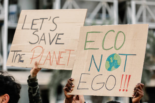 istock Group of activist people holding placards and banners for climate change 1791419971