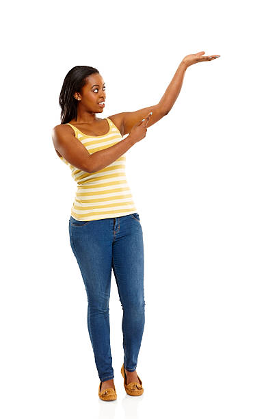 istock African woman showing empty space for your advertisement 179142546