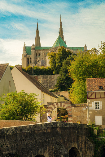 Female tourist in the town of Chartres, south west of Paris, France.
