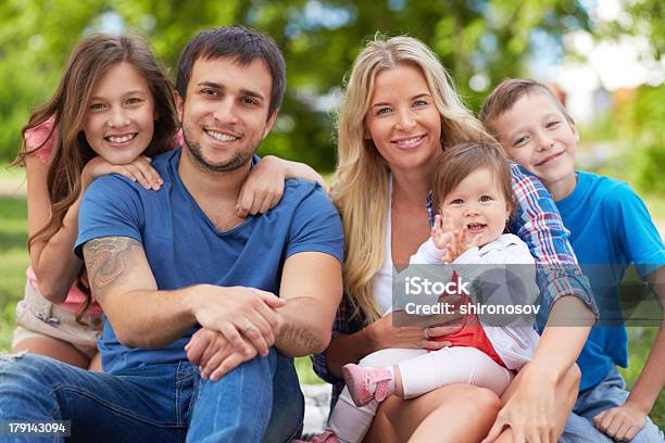 Family In Park Stock Photo - Download Image Now - Adult, Affectionate, Baby - Human Age