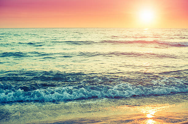 istock sunset at the horizont on sea 179144450