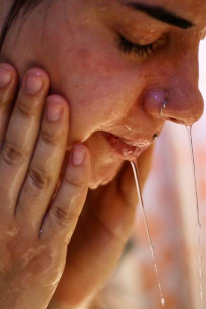 istock Young woman wash her face 1791445454