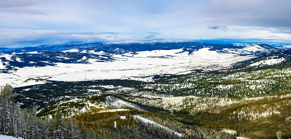 Discovery ski panorama, near Philipsburg, Montana as viewed from Rumsey peak. Black Pine Ridge, Silver King Mountain, Pole Ridge and Jenkins Ridge are visible at the horizon of the winterly landscape.