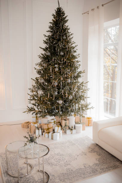 istock interior christmas. magic glowing tree, fireplace and gifts 1791470845