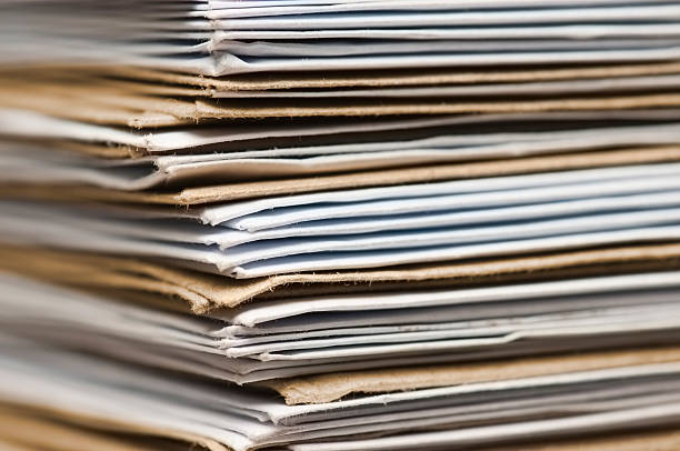 istock Pile of brown and white envelopes received in post 179147099