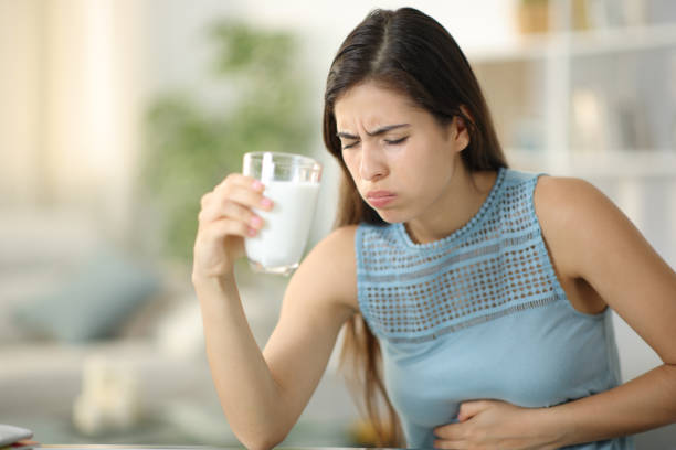 istock Woman suffering belly ache drinking milk 1791488614