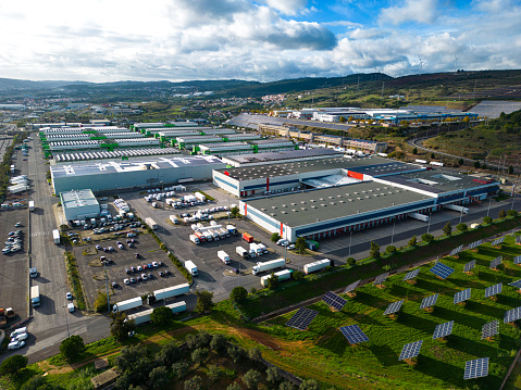 Drone footage of commercial warehouse park, with its logistics and energy management park