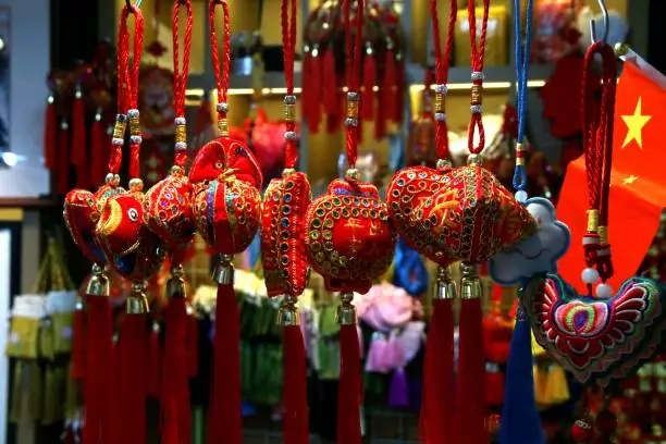 Photo of Chinese amulets and souvenirs in a souvenir shop.