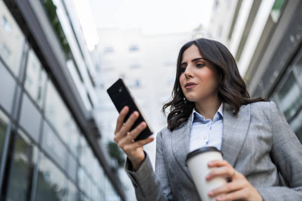 istock Businesswoman's Coffee and Phone Harmony 1791510105