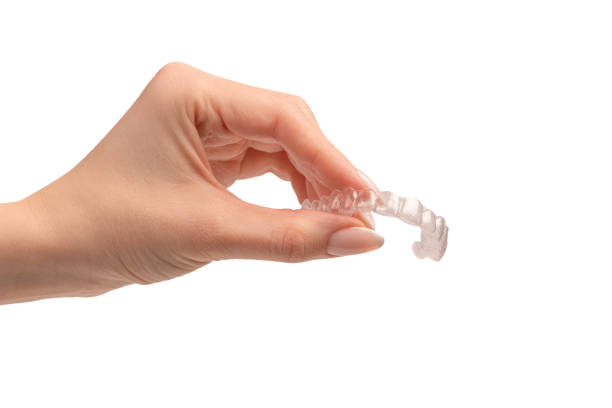 istock Transparent mouth guard in a woman's hand isolated. 1791511248