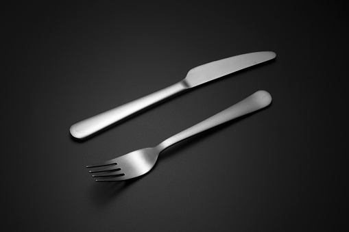 cutlery over black background