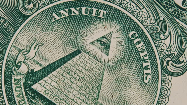 Mason Sign Symbol of the All Seeing Eye Rotates on a One Dollar Bill Close-Up